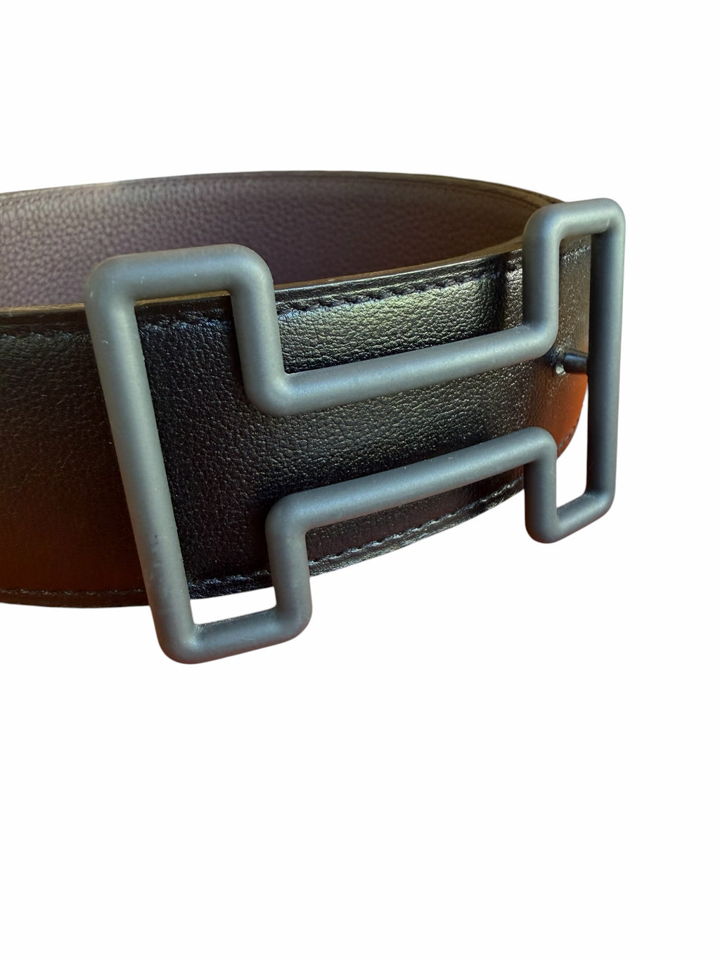Studio444 black leather waist belt featuring a modern matte H-shaped buckle and textured finish