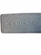 Studio444 HERMÈS leather belt featuring embossed branding and detailed stitching on textured black leather.